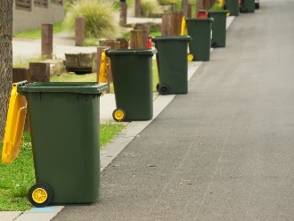 Recycling bins on a street. 